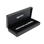 A silver pen decorated with colorful heart patterns. The pen features the "Britto" logo around the cap. Colors used include red, yellow, blue, green, and black.  Pens  FineTip  Black Ink  designer pen