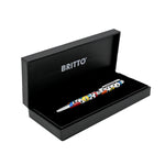 A silver pen featuring colorful abstract designs in shades of orange, red, yellow, teal, and blue, along with the "Britto" logo around the middle.  Pens  Fine Tip  Black Ink  designer pen